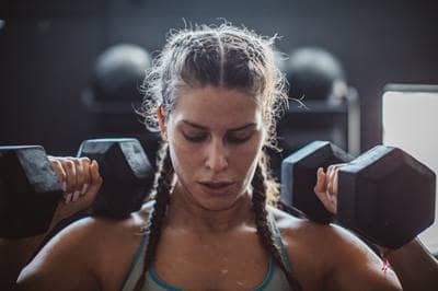 woman lifting weights