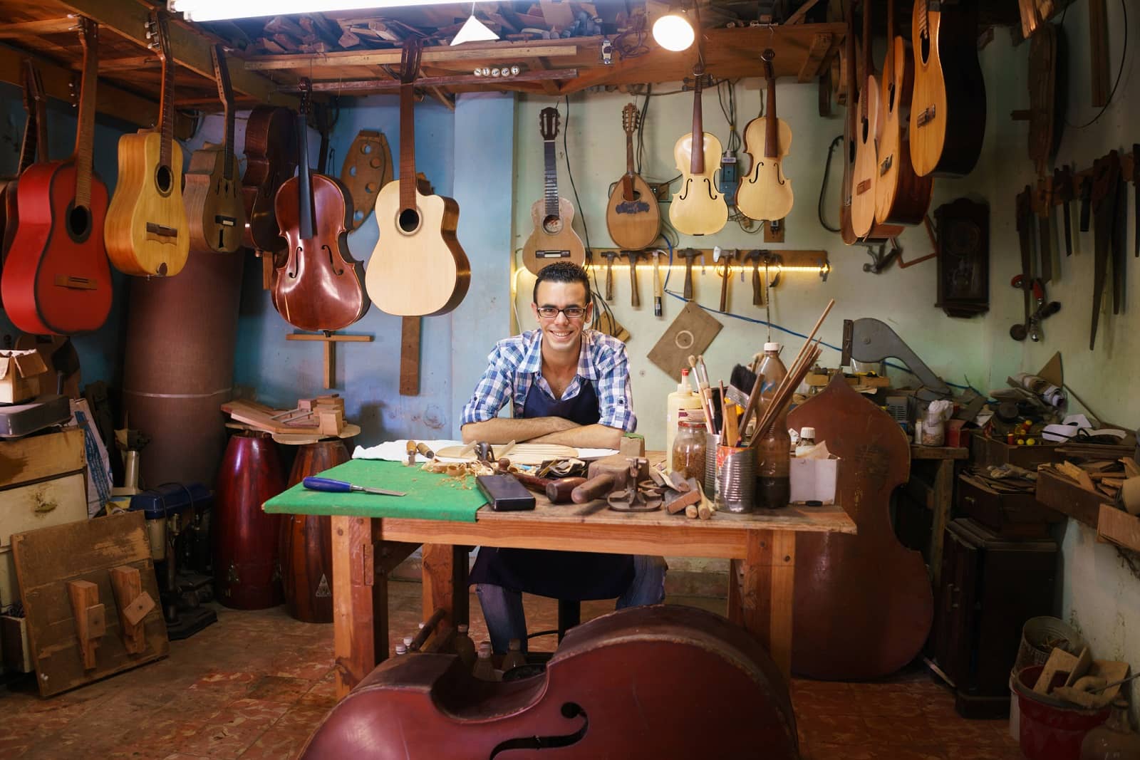 Male employee at guitar shop