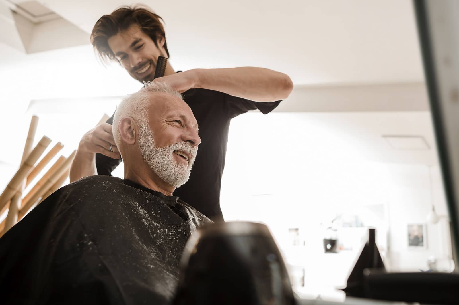 Senior man getting hair cut
