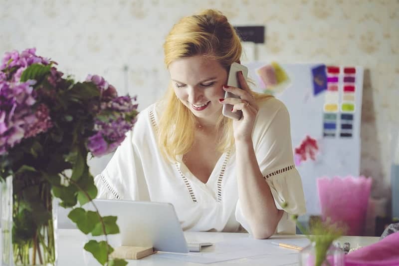 Woman on phone at desk