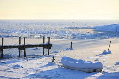 Frozen lake piled with snow