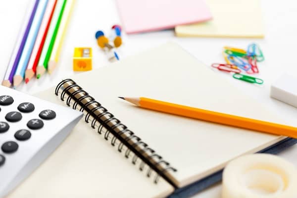 Blank notebook and school supplies