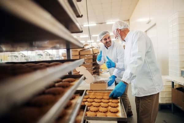 two bakers preparing food