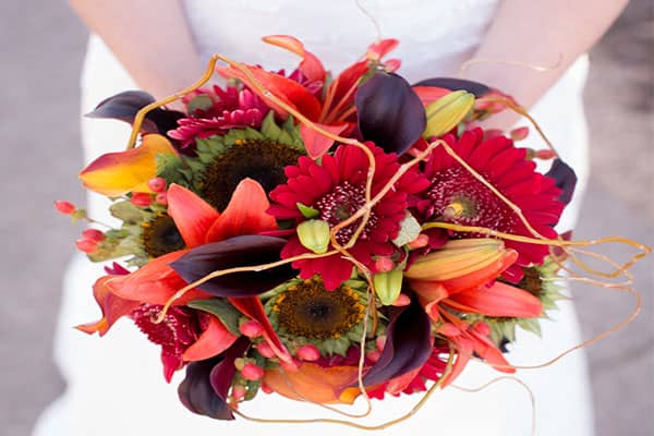 Bride holding fall wedding bouquet